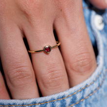 Load image into Gallery viewer, Sophie d'Agon, bague or jaune 18 carats, petit coeur rubis rouge porté

